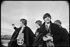 The Beatles being driven away from the Rongotai airfield on the back of a ute, 21 June 1964.  