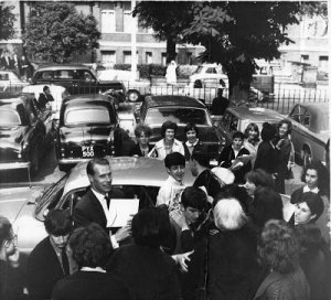 The date of this photo is July 1 1963 and look at all of the fans who are already hanging around EMI while the Beatles are recording. 