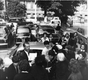 The date of this photo is July 1 1963 and look at all of the fans who are already hanging around EMI while the Beatles are recording. 