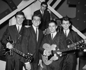    * English pop singer Billy J. Kramer posed with backing