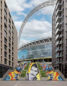 A giant anamorphic mural of Freddie Mercury has been painted onto the steps at Wembley Park to celebrate what would have been his 80th birthday. The tribute was created by artist Frank Styles.