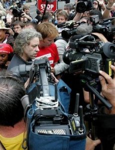 Bob Geldof (centre, left) speaks to the waiting media at Waverley Station, Edinburgh, Tuesday July 5, 2005. Live-8 organizer Geldof said it would be 'grotesquely irresponsible' for politicians to back down from promises of aid for impoverished Africa. Geldof has called for 1 million people to take part in a 'Long Walk to Justice' on Wednesday to pressure Group of Eight leaders meeting this week in nearby Gleneagles