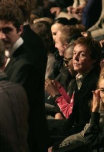 Singer Paul McCartney (C) attends the Spring/Summer 2007 ready-to-wear fashion collection designed by his daughter Stella McCartney in Paris October 5, 2006. 