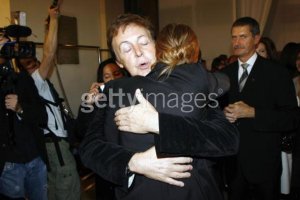 PARIS - OCTOBER 5 : Musician Paul McCartney hugs his daughter Stella McCartney at the Stella Mc Cartney Fashion Show, as part of Paris Fashion Week Spring/Summer 2007 on October 5, 2006 in Paris, France.